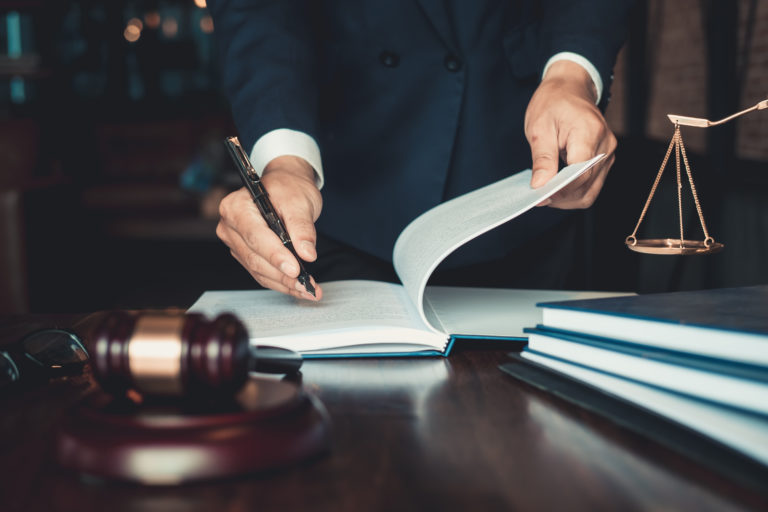 A Lawyer signing a petition in Indianapolis, IN